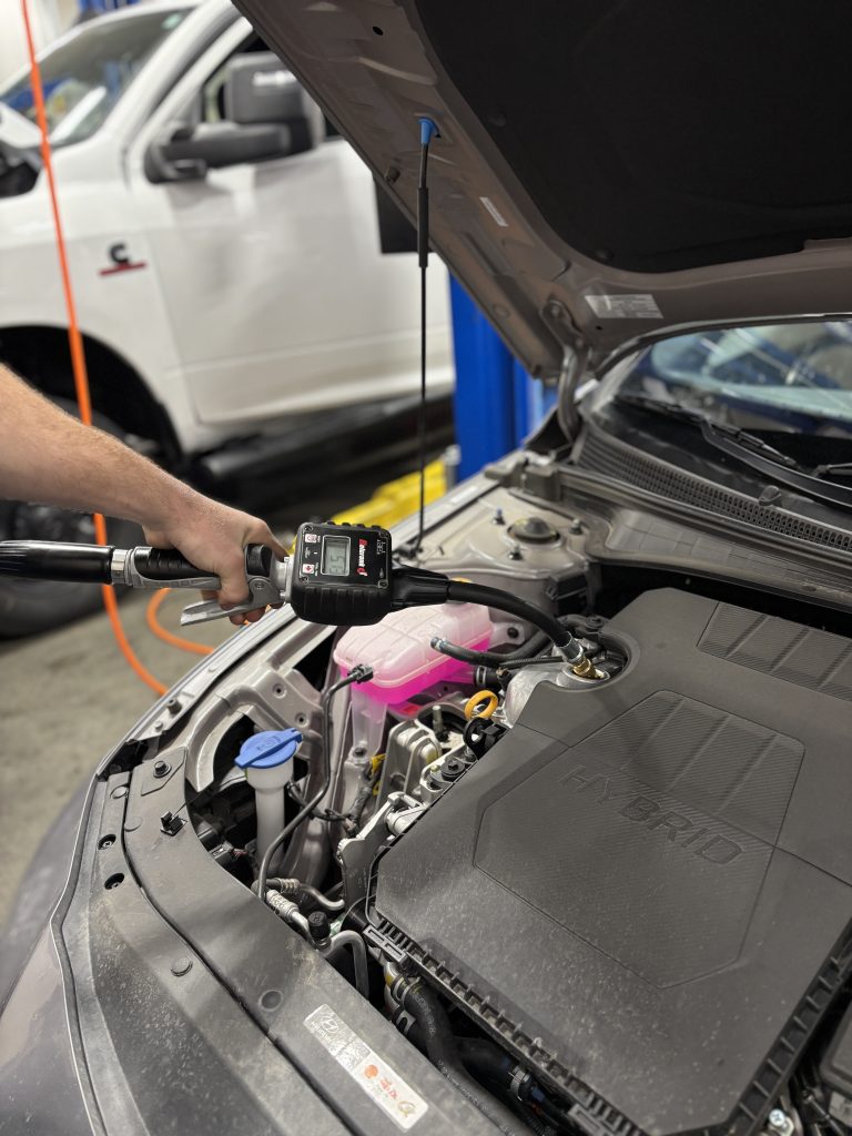 Image of an oil pump filling an engine with new engine oil