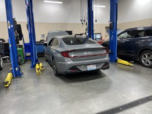 Hyundai in the service department getting work done